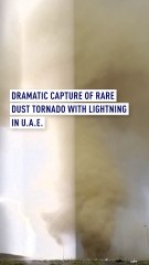 Dust tornado with striking lightning captured near road in Sharjah, UAE