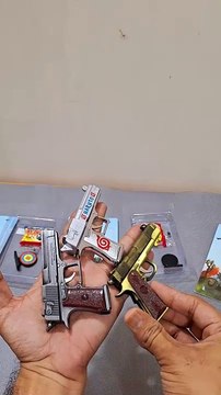 Pocket-Sized Fun! World's Smallest Toy Rubber Bullet Gun in Action!