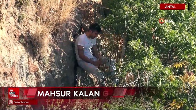 Antalya'da uygunsuz davranış sergileyenleri uyarmak için çıktığı kayalıklarda mahsur kaldı