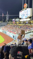 Woman is looking for a bearded man at a ballgame!
