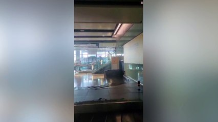 “Sewage” water pours onto baggage carousel at airport