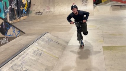 Young man's perfect scooter skating experience cut short by a sudden slip