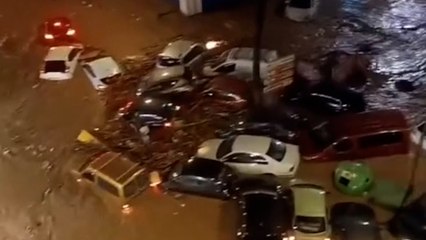 Terrifying footage shows flash floods sweeping away vehicles in Spain