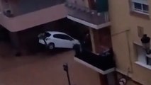 Footage shows vehicles and streets submerged in floodwater in Spain