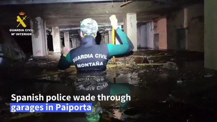 Spanish police wade through garages near Valencia in search for flood victims