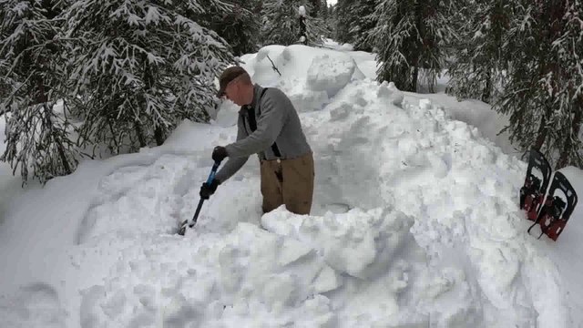 Winter Camping in Bushcraft Shelter with Animal Hides for a Bed (in Deep Snow)