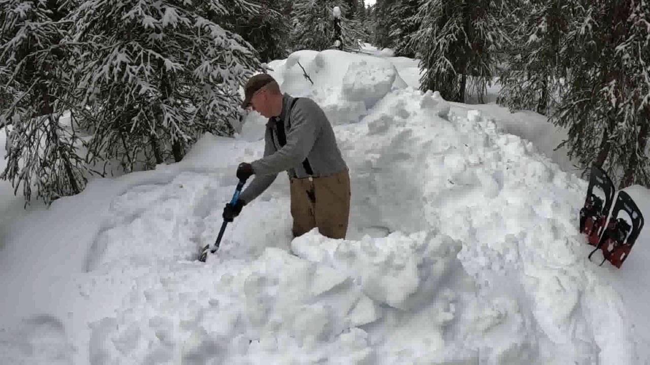 Winter Camping in Bushcraft Shelter with Animal Hides for a Bed (in Deep Snow)