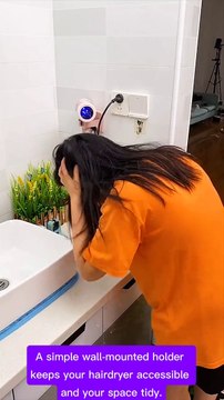 Declutter Your Bathroom: Wall-Mounted Hairdryer Holder Solution. #BathroomOrganization #HairdryerHolder #Declutter #HomeOrganization #BathroomStorage #EasyInstall #SpaceSaver #BathroomMakeover