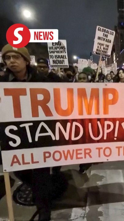 Protesters march in downtown Chicago following Trump's win