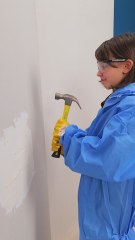 Father and Child Team Up for an Epic Wall Repair Adventure