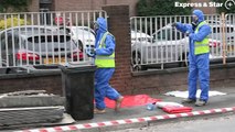 Specialist council workers clean up fly-tipped asbestos in Willenhall.