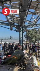 At least 24 killed in Pakistan train station bomb blast