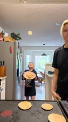 Mother and son takes turns flipping pancakes at each other!