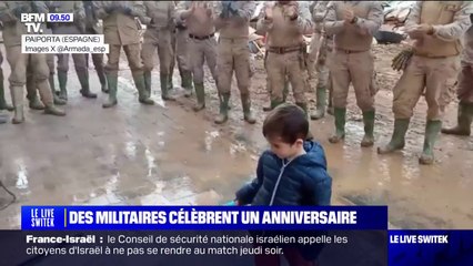 À Paiporta en Espagne, des militaires célèbrent l'anniversaire d'un petit garçon