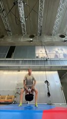 Acrobatic partners are doing a hand-to-hand Duo Hold during training!