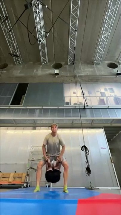 Acrobatic partners are doing a hand-to-hand Duo Hold during training!