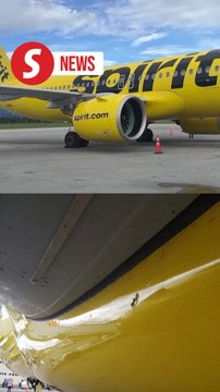 Flight attendant wounded, Spirit Airlines jet hit by armed-gang gunfire