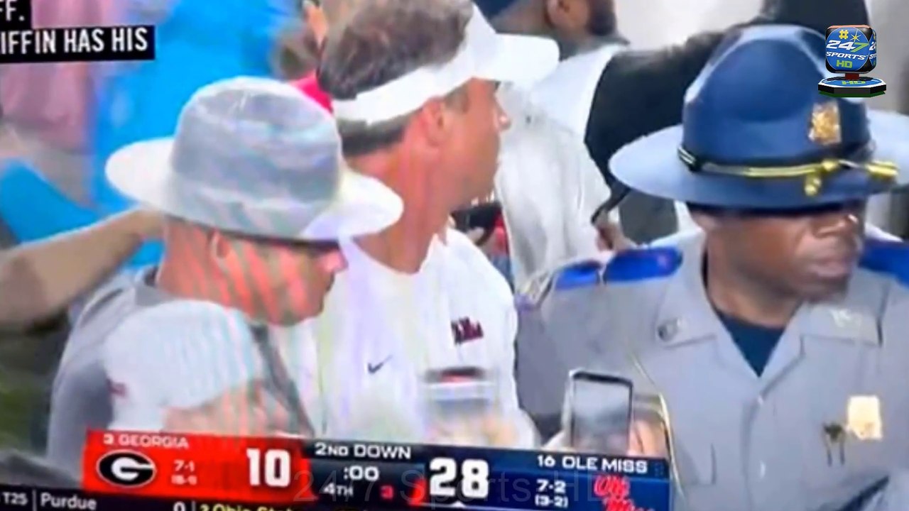 Crazy Moment Mississippi State Trooper Brutally Knocks Out a Fan Who Got Too Close to Coach