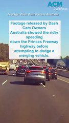 Motorcyclist somersaults on to car roof in highway collision