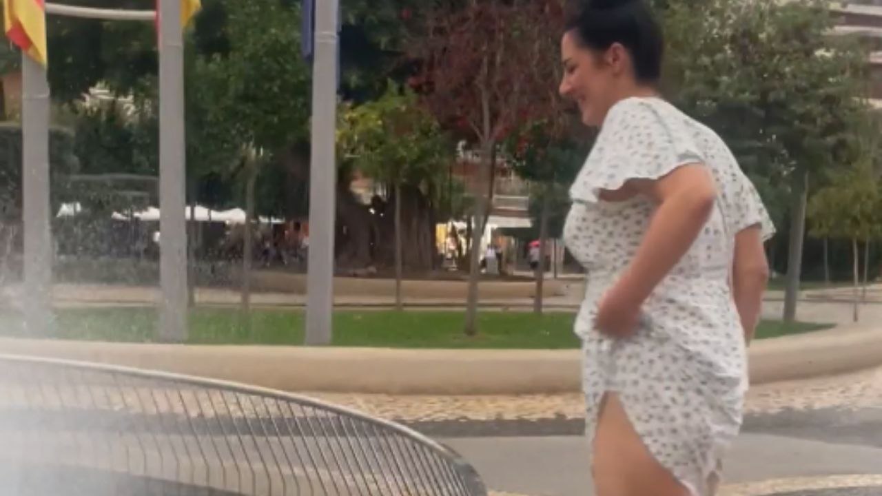 Woman falls into a fountain after trying to cool off in the mist