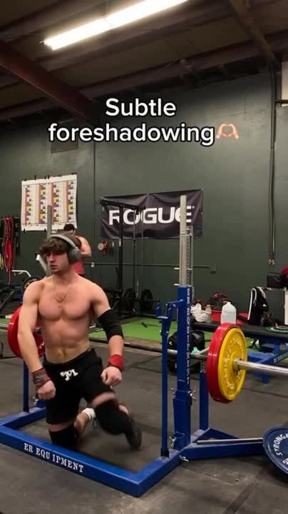 Man attempts barbell squat