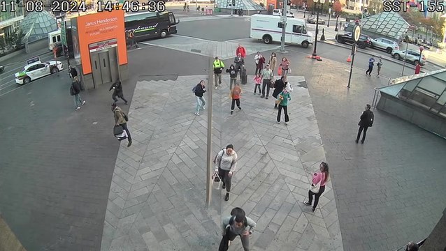 Falling scaffolding plank narrowly misses commuters outside train station