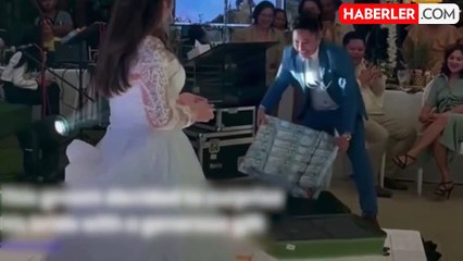 Damattan geline ilginç hediye: 17 bin doları halı gibi gelinin önünde serdi