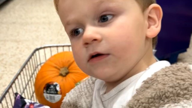 Dad tries to scare little baby with Halloween mask but he is not amused