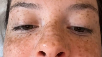 Baby girl smiles from ear to ear as she sees herself on camera