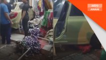 Pacuan empat roda terbabas ke dalam kedai pakaian