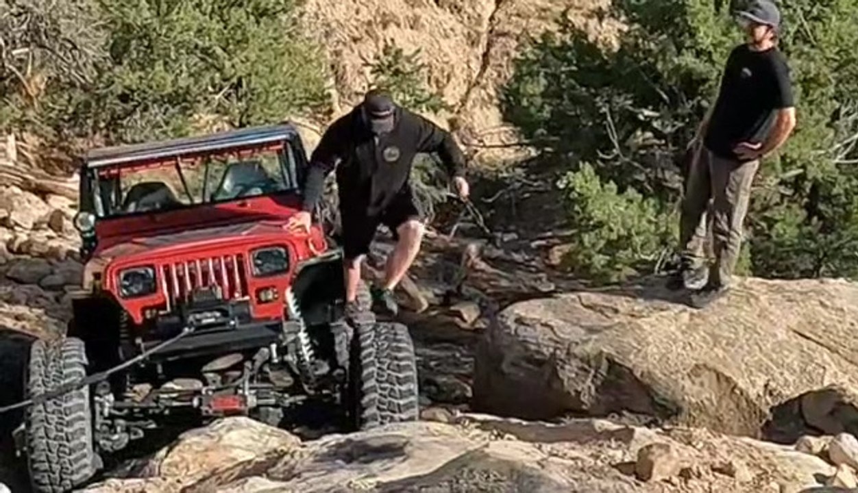 Man Climbs on Tire and Falls After Tire Starts Spinning