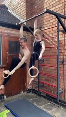 Father and daughter are doing a fitness challenge on a pullup bar with gymnastics rings!