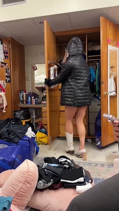 Girl is cleaning out her dorm closet and wearing a little bit of everything!