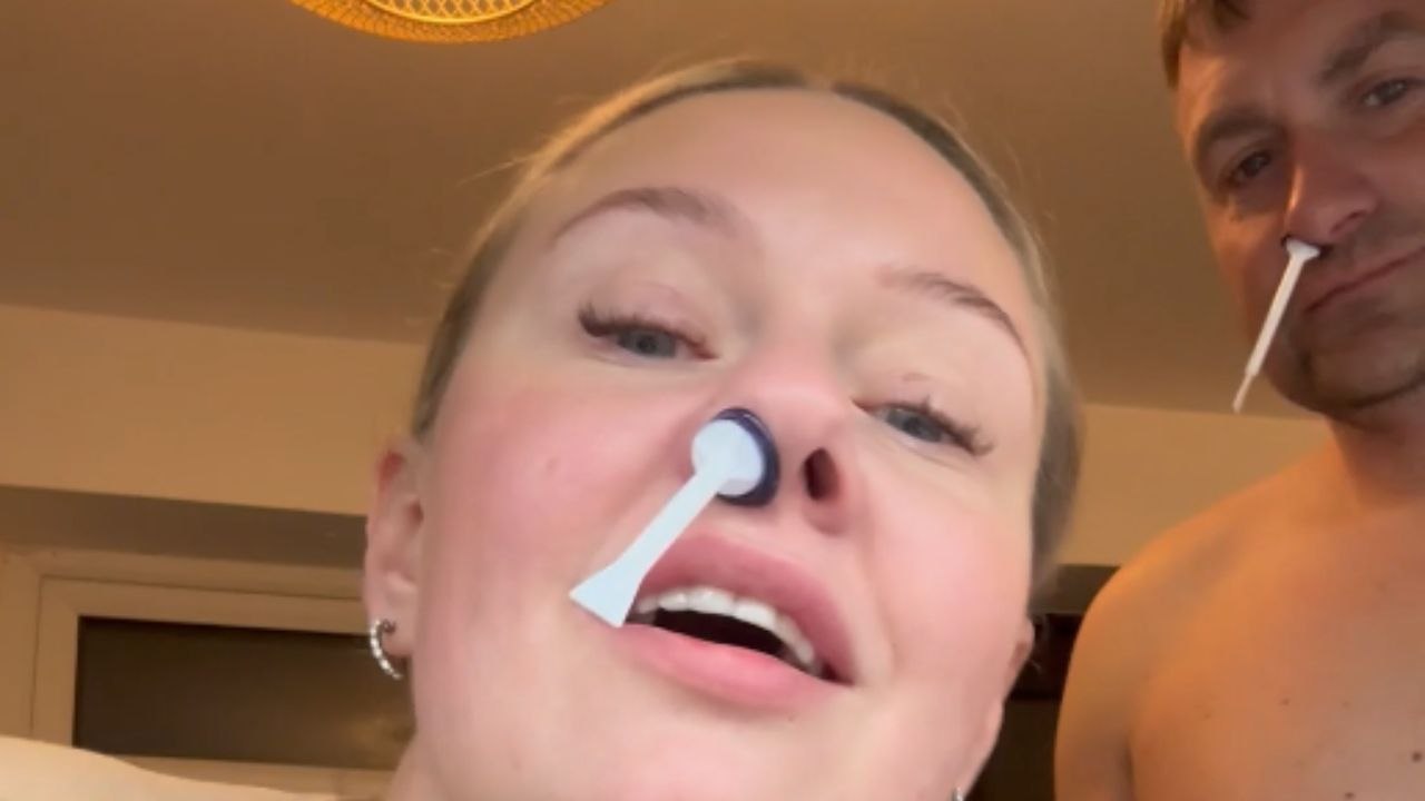 Man’s fear of nose waxing ends when woman pulls nose wax stick out