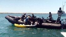 Police officers interact with protesters on the water at Newcastle during Rising Tide demonstration | Newcastle Herald | November 23, 2024