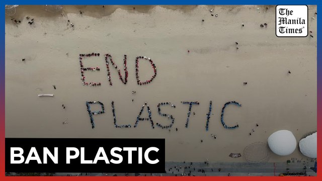 Activists form giant human sign to 'end plastic' ahead of UN talks in South Korea