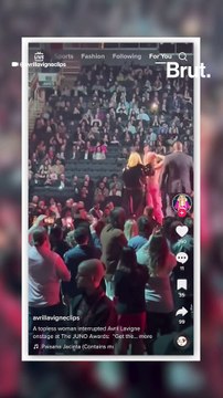 Topless protester interrupts Avril Lavigne