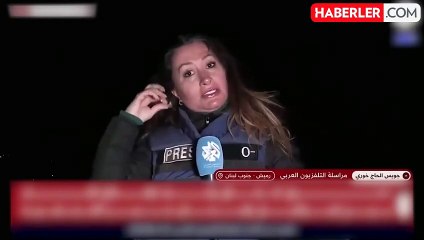 Lübnanlı muhabir ateşkes antlaşmasını kask ve çelik yeleğini çıkararak duyurdu