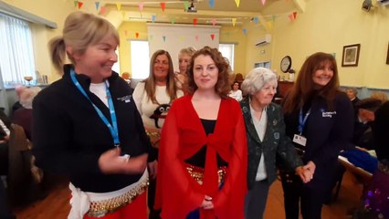 Dementia support  club take part in belly dancing.