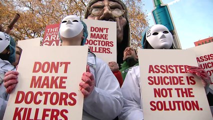Protesters gather by Parliament as MPs debate assisted dying