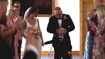 Disabled boy fulfils dream of walking mother down aisle at her wedding