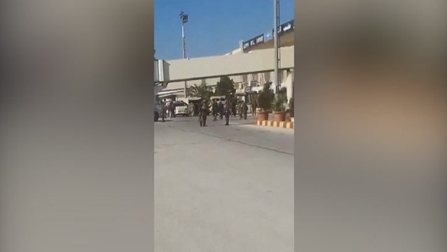 Armed men seen at Aleppo airport after rebels take control of Syrian city