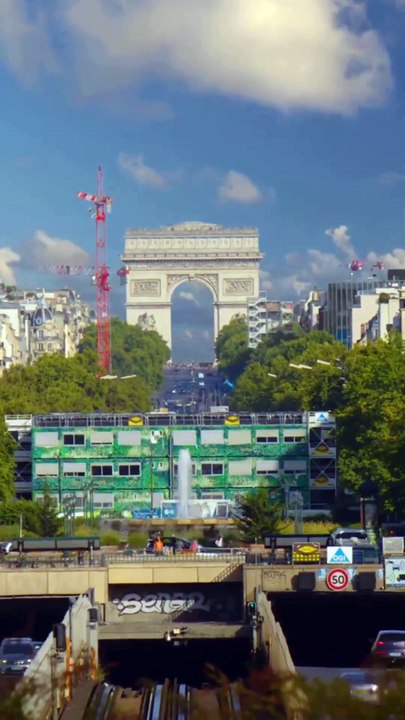 The Arc de Triomphe at the end of the Champs-Élysées Avenue in Paris, France