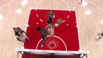 Johnson hits the switch-hand dunk for the Hawks