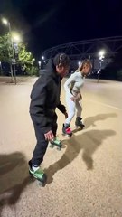 Friends are skating backwards really quickly together!