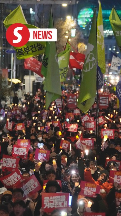 South Koreans march in rain to protest Yoon after botched martial law attempt