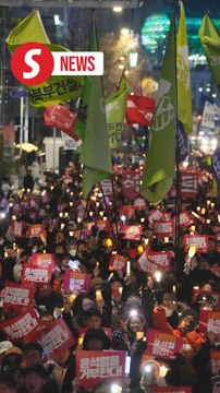 South Koreans march in rain to protest Yoon after botched martial law attempt