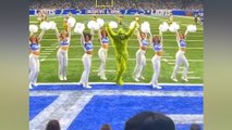 Lions get crashed by the Grinch stealing the show from the cheerleaders with his bold moves