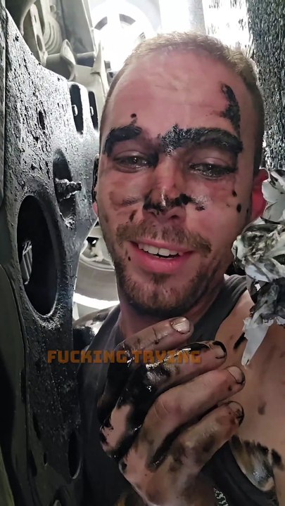 Man is trying to change the oil in his car and ends up covered in motor oil!