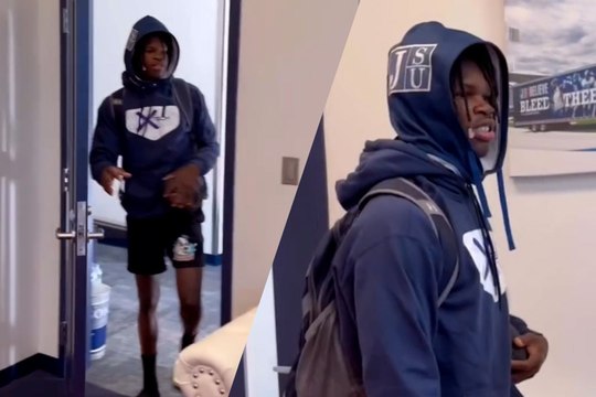 Deion Sanders watches as Travis Hunter tries to steal with Shedeur Sanders